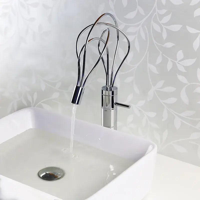 Modern chrome led waterfall bathroom faucet with blue light stream and distinctive whisk-like spout design by decorbites led waterfall