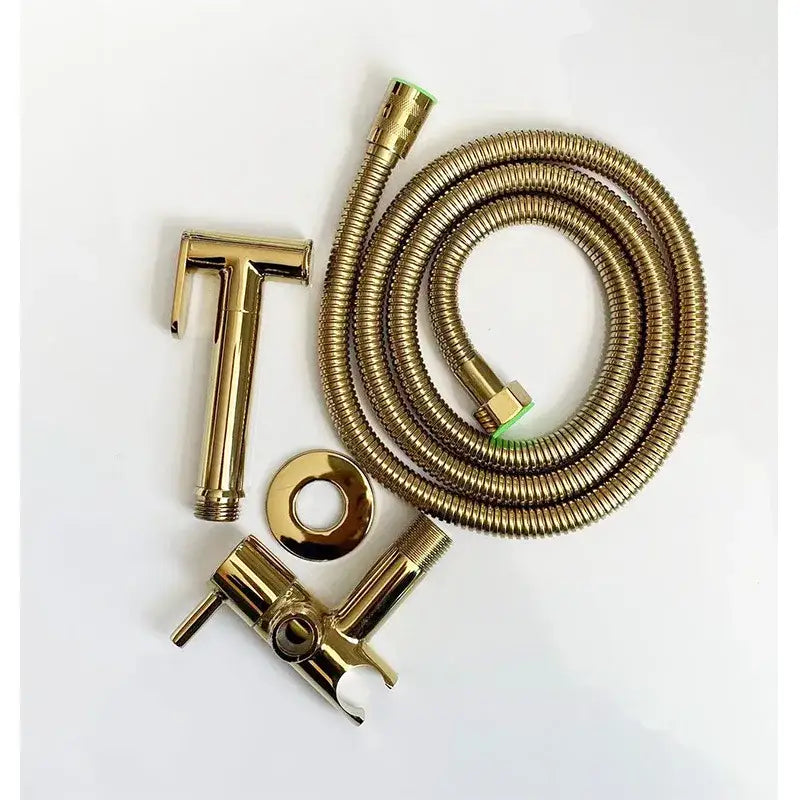 Gold-colored brass bidet spray set with flexible corrugated hose and matching showerhead for modern bathroom use