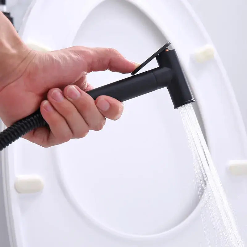 Modern chrome and black matte bidet spray set with sleek design and flexible hose for bathroom handheld use