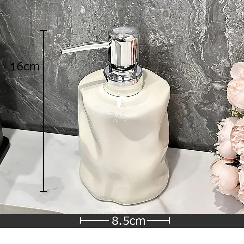 Cream-colored decorbites wrinkle ceramic soap dispenser with sleek chrome pump for modern bathroom decor
