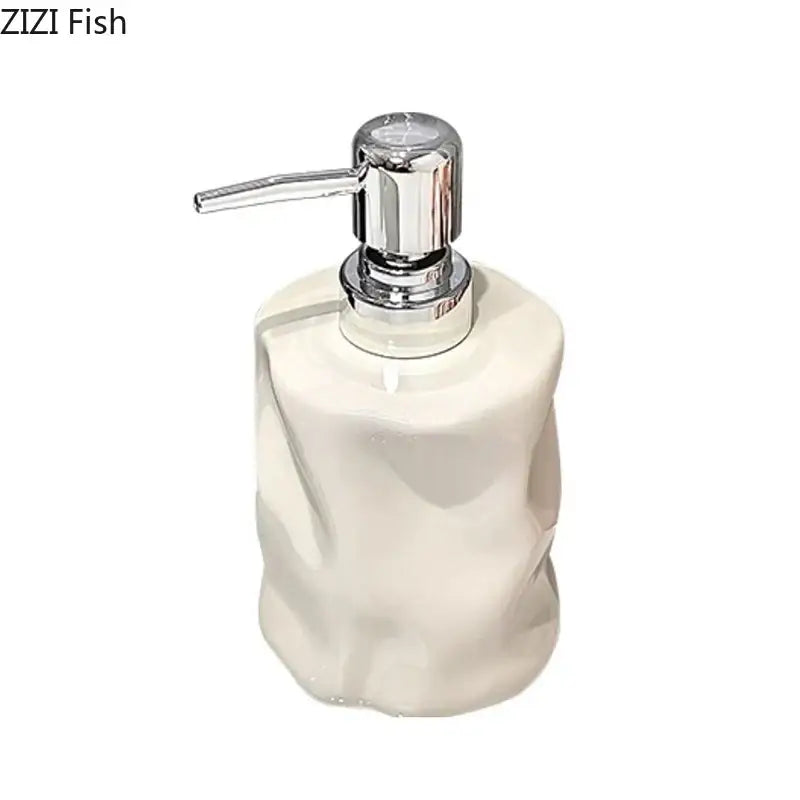 Cream-colored matte white wrinkle ceramic soap dispenser with a sleek chrome pump from decorbites wrinkle ceramic set