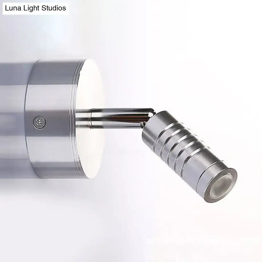 A sleek modern wall lamp with mini tubed polished chrome design providing warm and white bathroom lighting