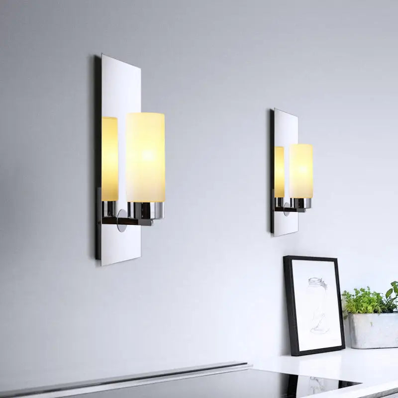 Modern chrome opal glass tube wall light with sleek chrome finish and warm cylindrical frosted opal glass shades