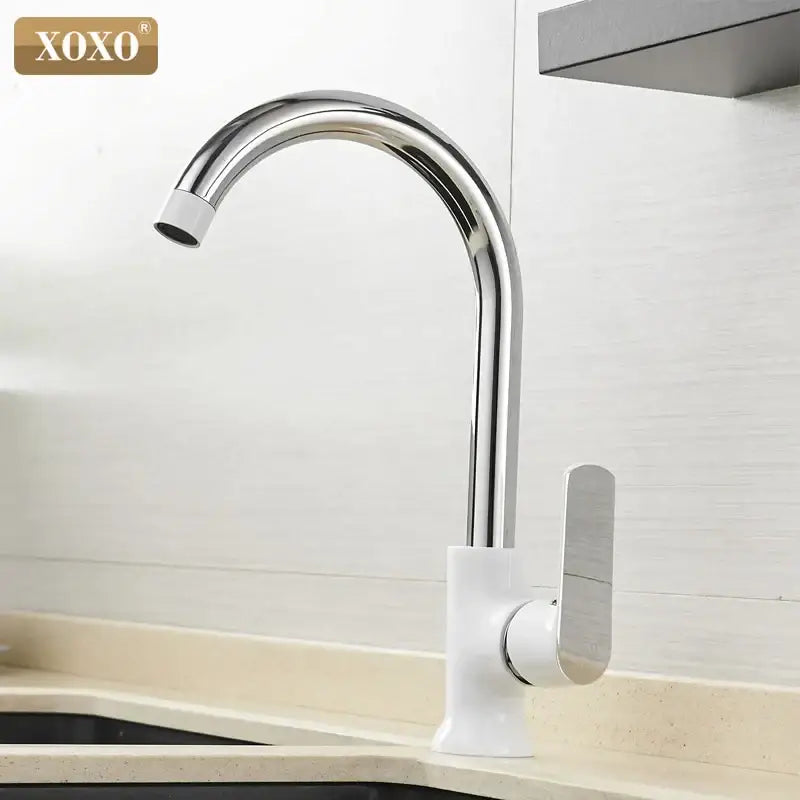 Modern chrome kitchen faucet with single handle and sleek white base featuring decorbites brass single design