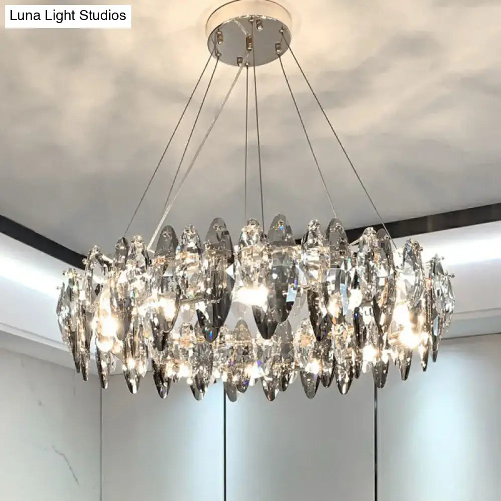 A modern 220v-240v minimalist oval crystal clear pendant chandelier with teardrop crystals and chrome ceiling mount