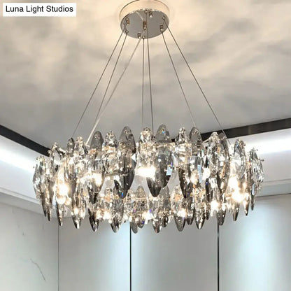 A modern 220v-240v minimalist oval crystal clear pendant chandelier with teardrop crystals and chrome ceiling mount