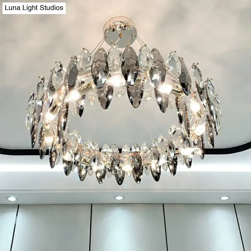A two-tiered minimalist oval crystal clear pendant chandelier with faceted crystals and polished chrome frame for 220v-240v use