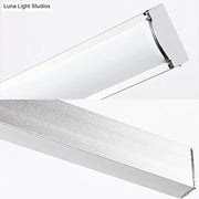 Modern chrome rectangular led wall light with sleek frame and frosted glass diffuser for bedroom sconce use