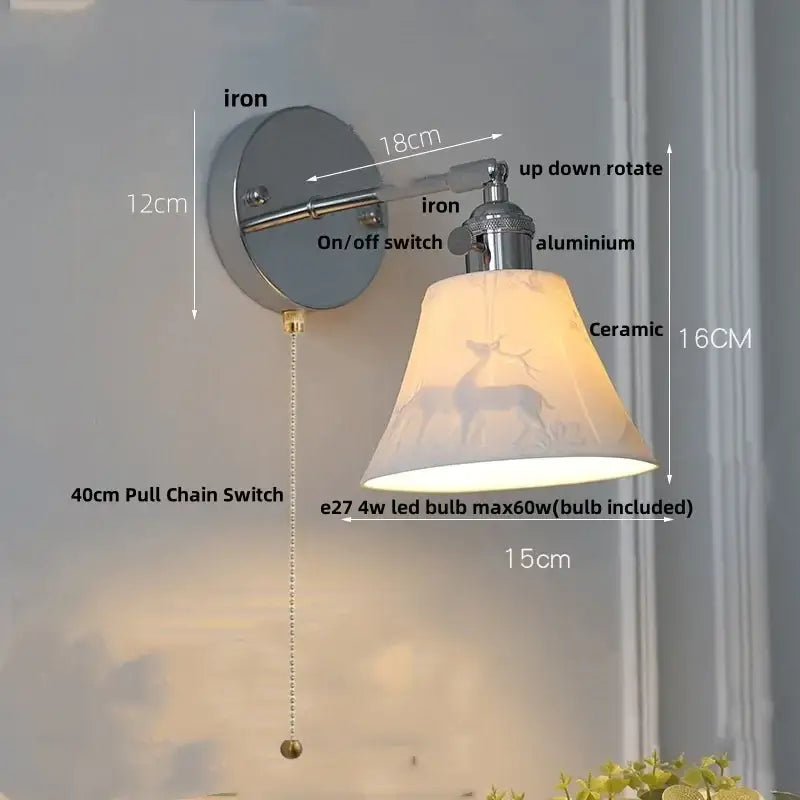 Vintage-style wall lamp with clear glass ceramic lampshade featuring a deer silhouette mounted on metal decorbites clear glass hardware