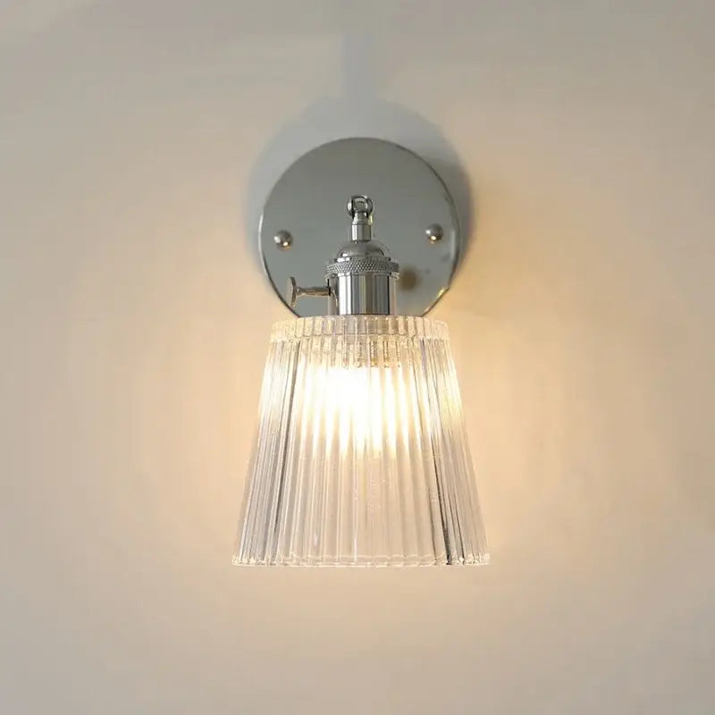 Modern chrome ribbed clear glass wall lamp with polished chrome mounting plate and decorbites clear glass shade