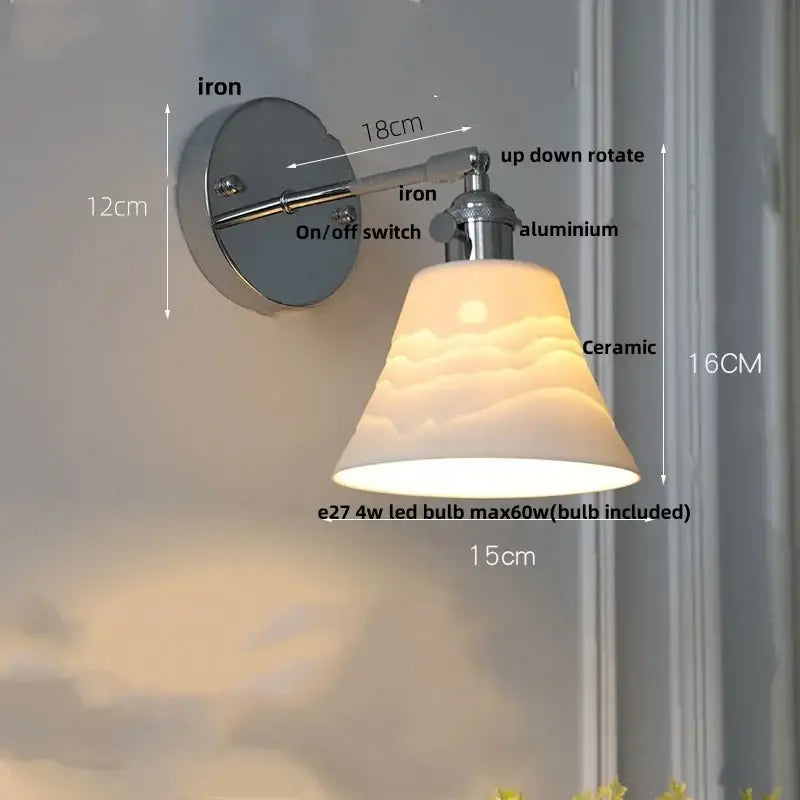 A modern chrome ribbed clear glass wall lamp with an adjustable ceramic shade featuring cloud and sun motifs for decorbites clear glass decor