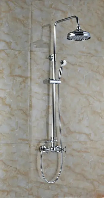 Modern chrome shower mixer faucet set with fixed overhead rainhead and handheld spray nozzle mounted on tiled walls