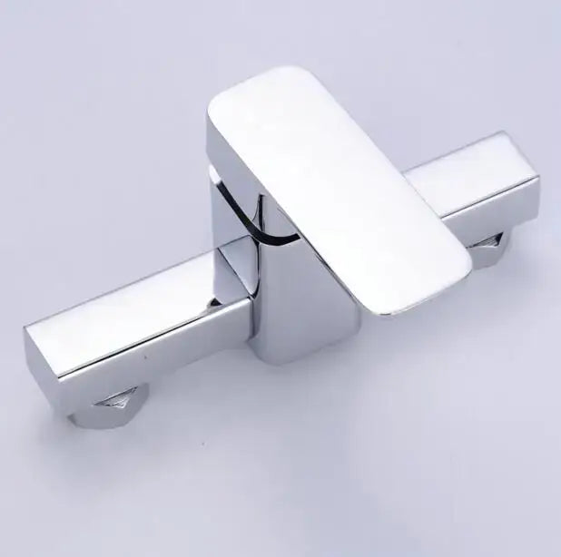 Modern chrome single handle shower mixer with sleek rectangular dual handles and decorbites brass single finish