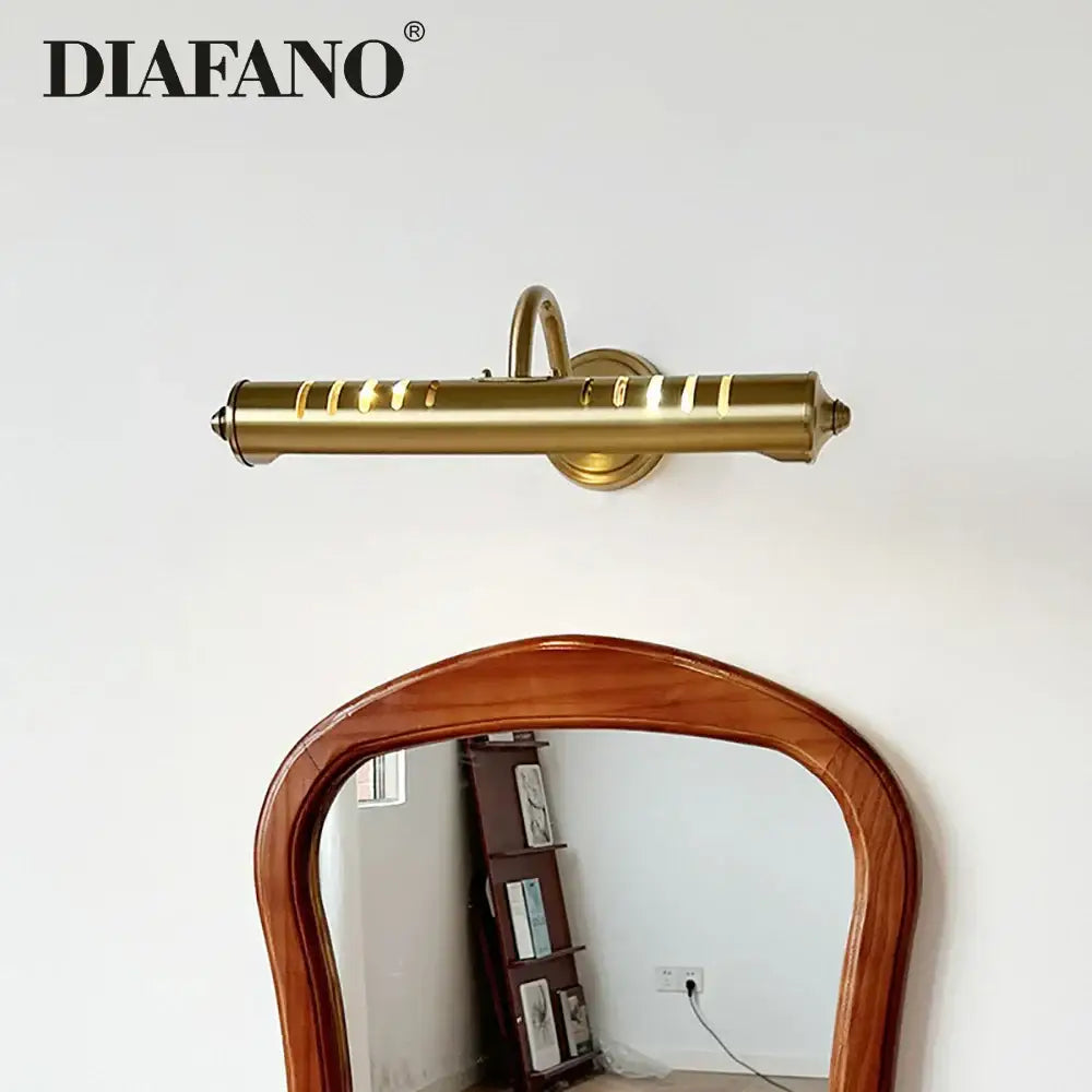 Gold-colored brass wall lamp with sleek cylindrical design and horizontal slits modern led vanity wall lamp