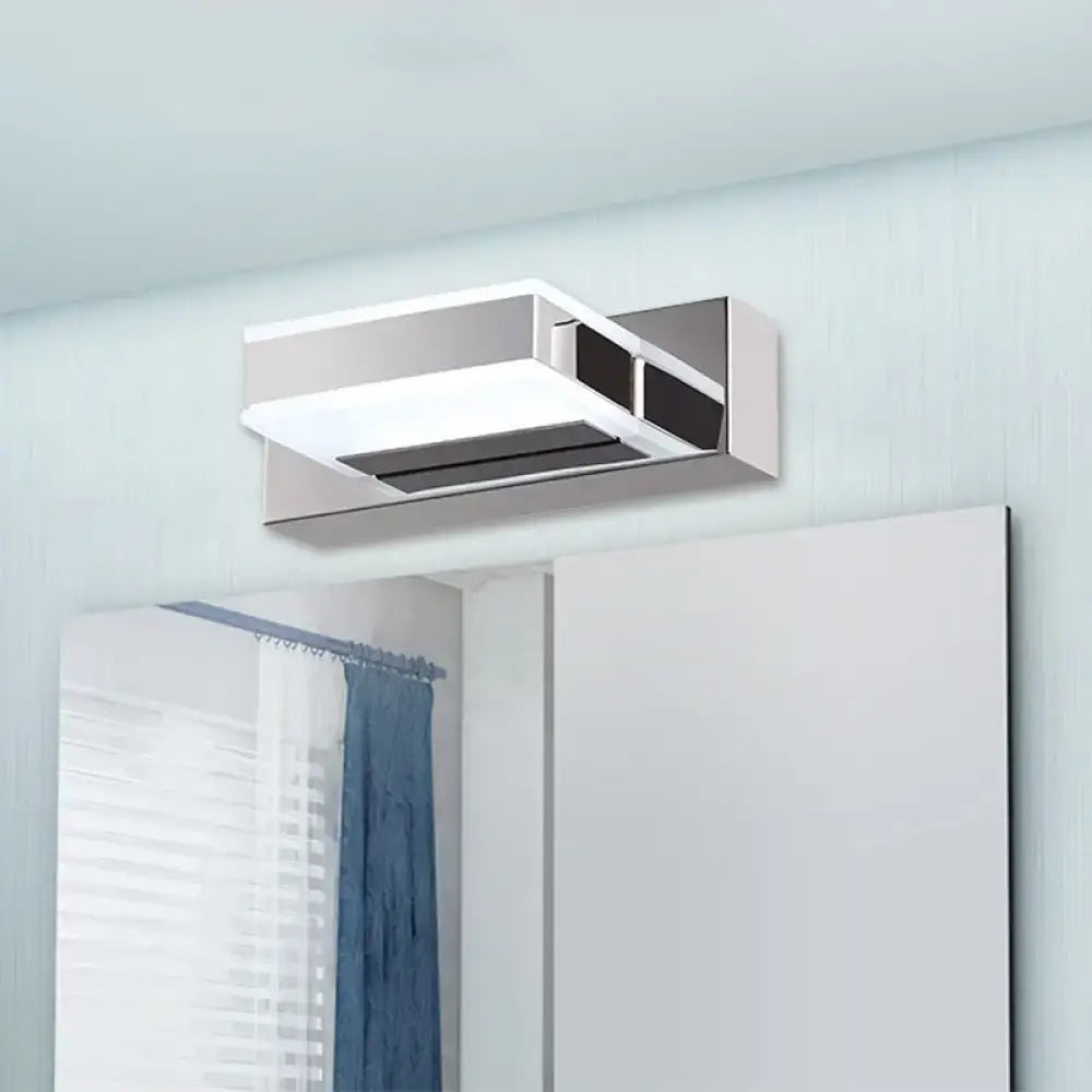Modern chrome square acrylic vanity light fixture with sleek design mounted above mirror showing fixture height