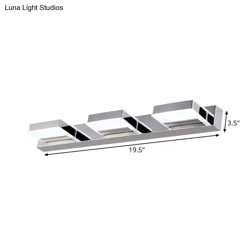 Modern chrome square acrylic vanity light with three rectangular led panels and black trim highlighting fixture height