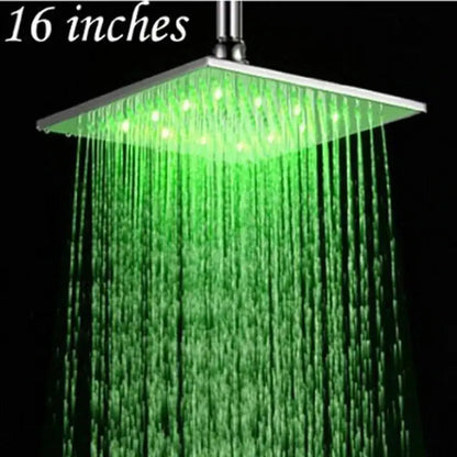 Modern chrome square rain shower head with sleek metallic finish and vibrant green led lighting for bathroom use