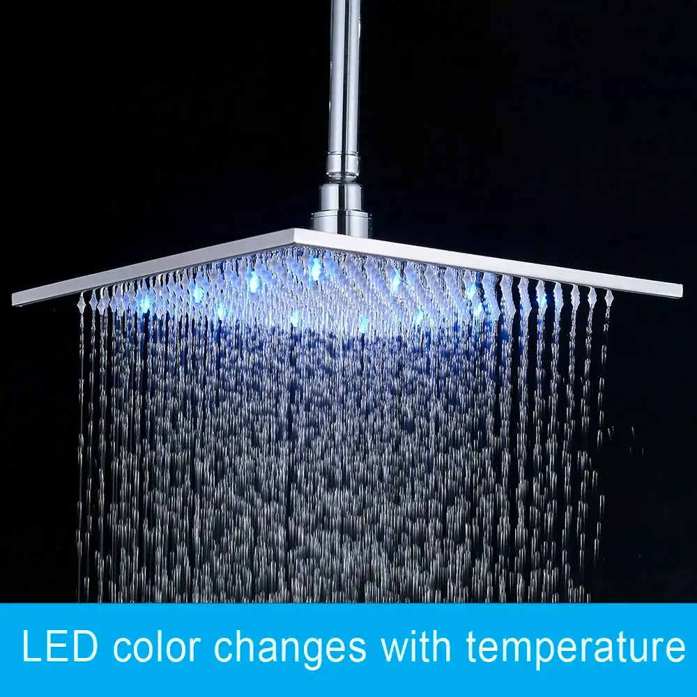 Modern chrome square led rainfall shower head with blue led lights illuminating water flow for bathroom use