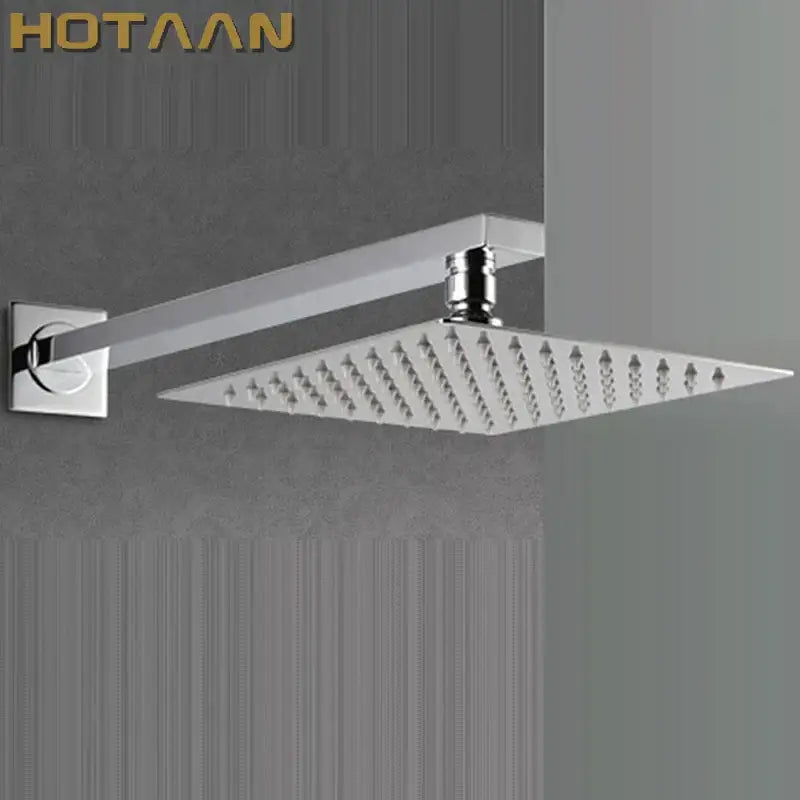 Modern chrome square rain shower head with arm featuring a sleek design and multiple water jets for bathroom use