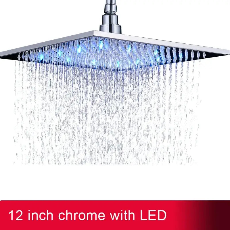 A sleek 12-inch chrome modern square rainfall shower head with vibrant blue led light for bathroom use