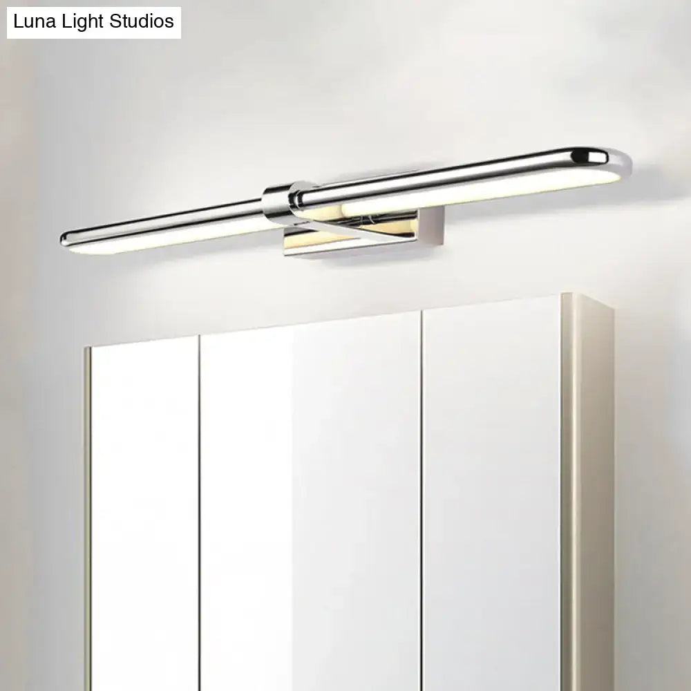 Modern chrome stainless steel led wall lamp with elongated acrylic oval shade mounted above bathroom vanity mirror