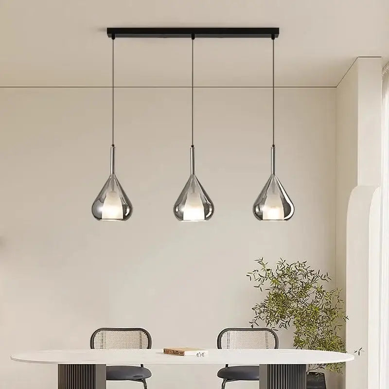 Modern chrome chandelier pendant lights with teardrop-shaped polished chrome shades for dining room lighting