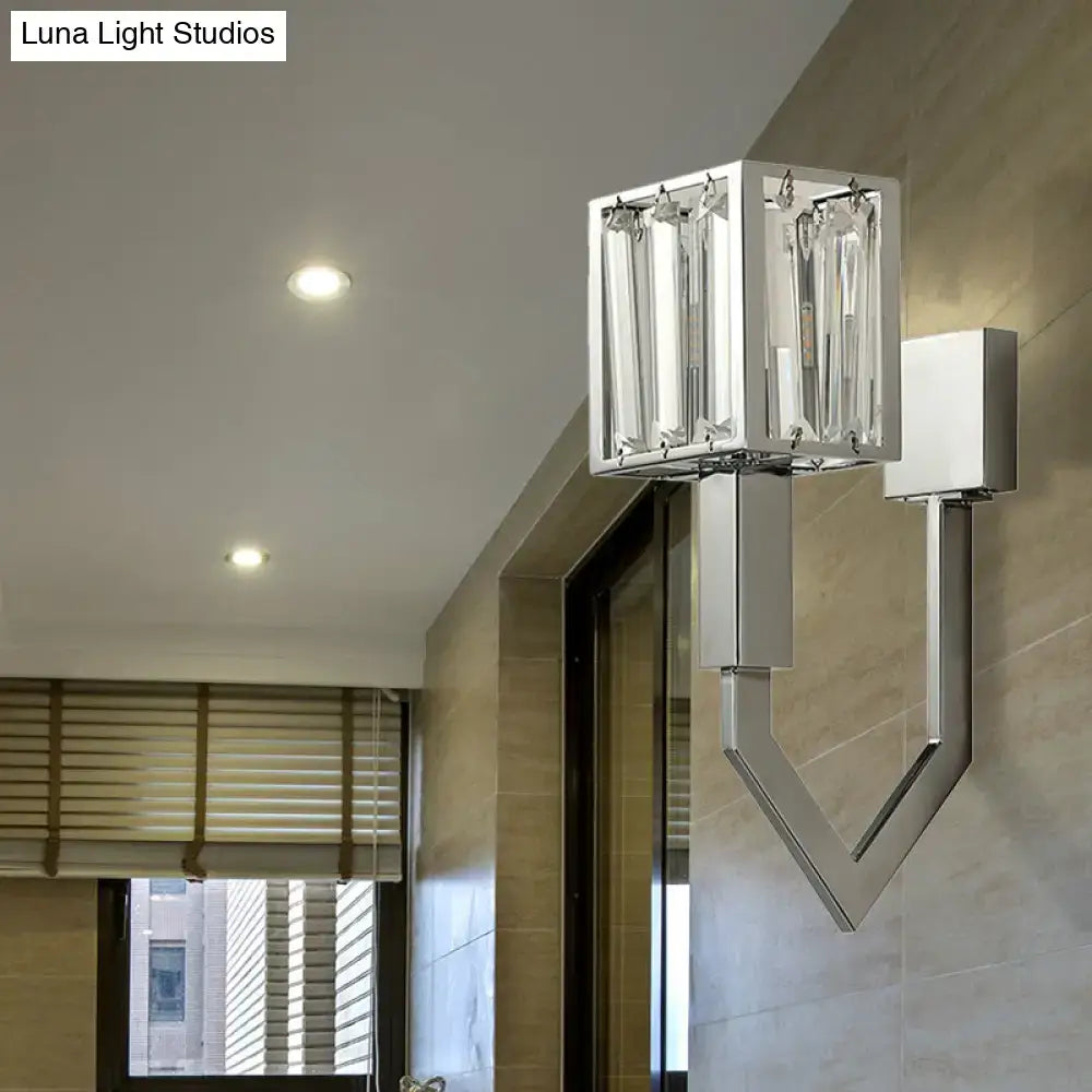Modern chrome wall lamp with metal frames featuring clear crystal accents and a geometric cube design for living room use