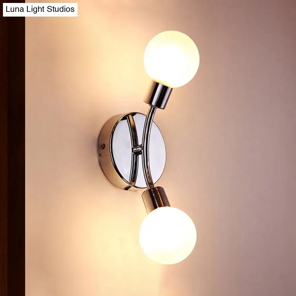 Modern chrome wall lamp with white glass fixture featuring two spherical frosted glass bulbs and chrome bulb base