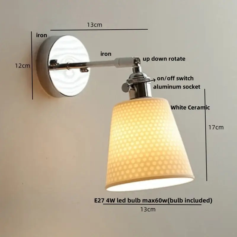 A sleek modern chrome wall light with a white perforated ceramic led shade and polished iron mount for bedroom decorbites ceramic led wall