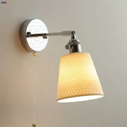 Modern chrome wall light with warm-toned perforated fabric shade and polished chrome arm by decorbites ceramic led