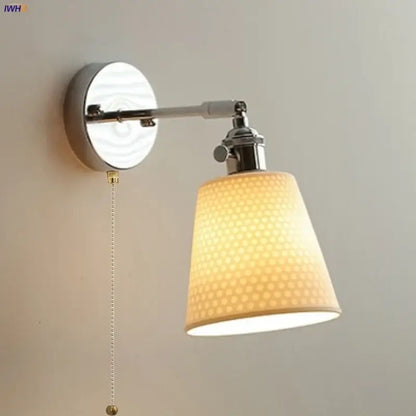 Modern chrome wall light with warm-toned perforated fabric shade and polished chrome arm by decorbites ceramic led
