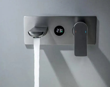 Modern chrome wall mounted basin faucet with brass valve core and digital temperature display showing 23°c