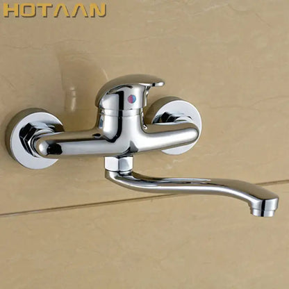 Modern chrome wall mounted kitchen tap with brass chrome dual control knobs and sleek curved spout by decorbites