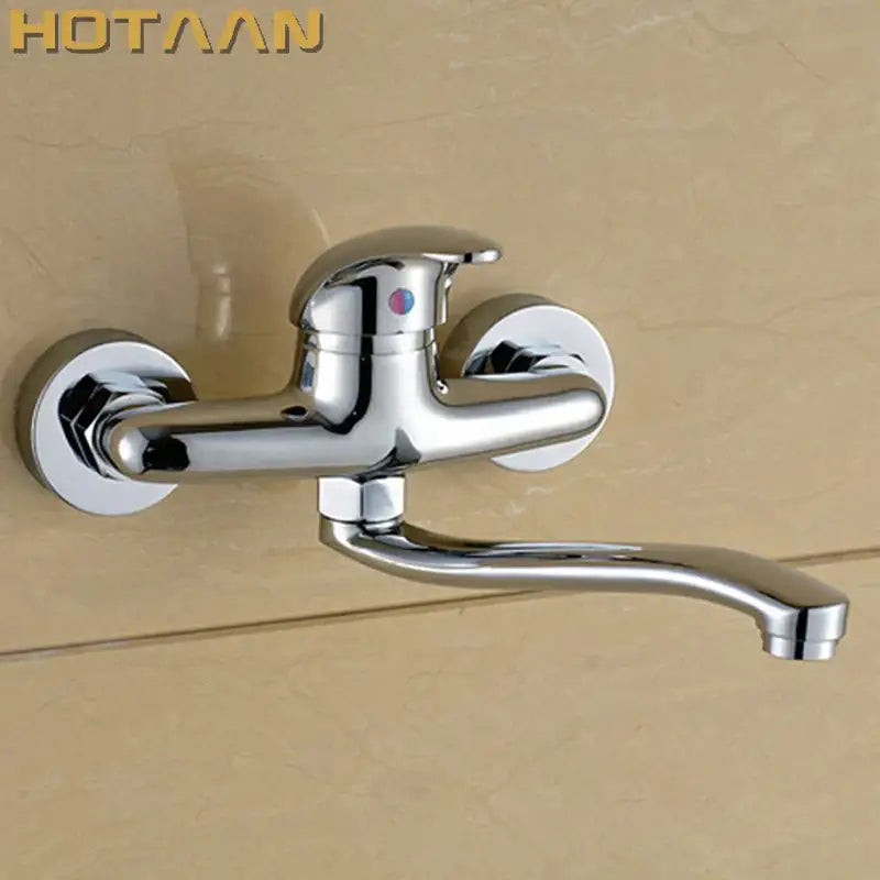 Modern chrome wall mounted kitchen tap with brass chrome dual control knobs and sleek curved spout by decorbites