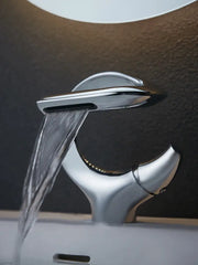 Modern chrome waterfall single handle bathroom faucet with sleek sculptural design for single hole installation