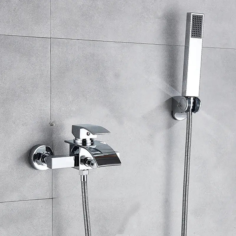 Modern chrome waterfall bathtub shower faucet with sleek angular design and matching handheld showerhead mounted on wall