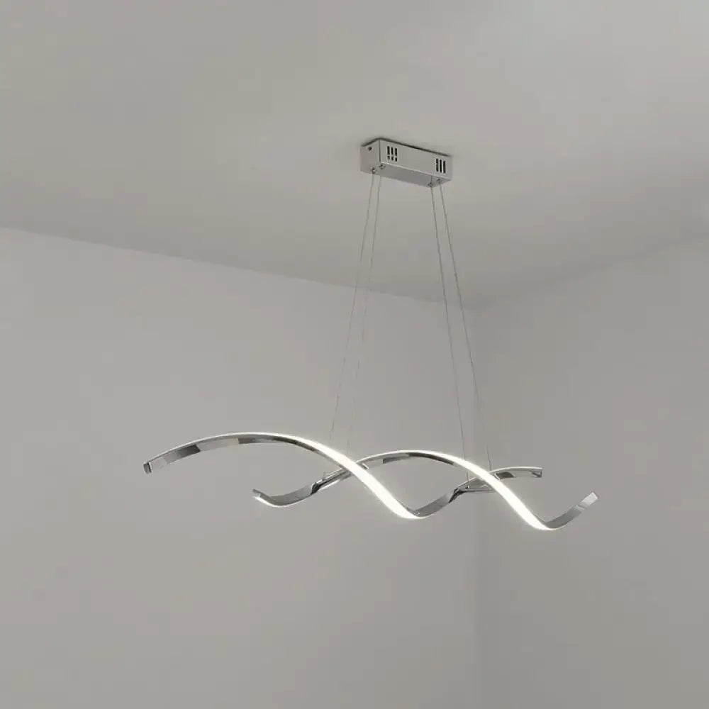 Modern chrome wave led island lighting with intertwined wave arms emitting bright white light for kitchen pendant use
