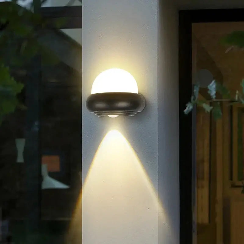 Modern circular black solar led wall light with warm dome-shaped frosted glass diffuser for garden decorbites led wall decor