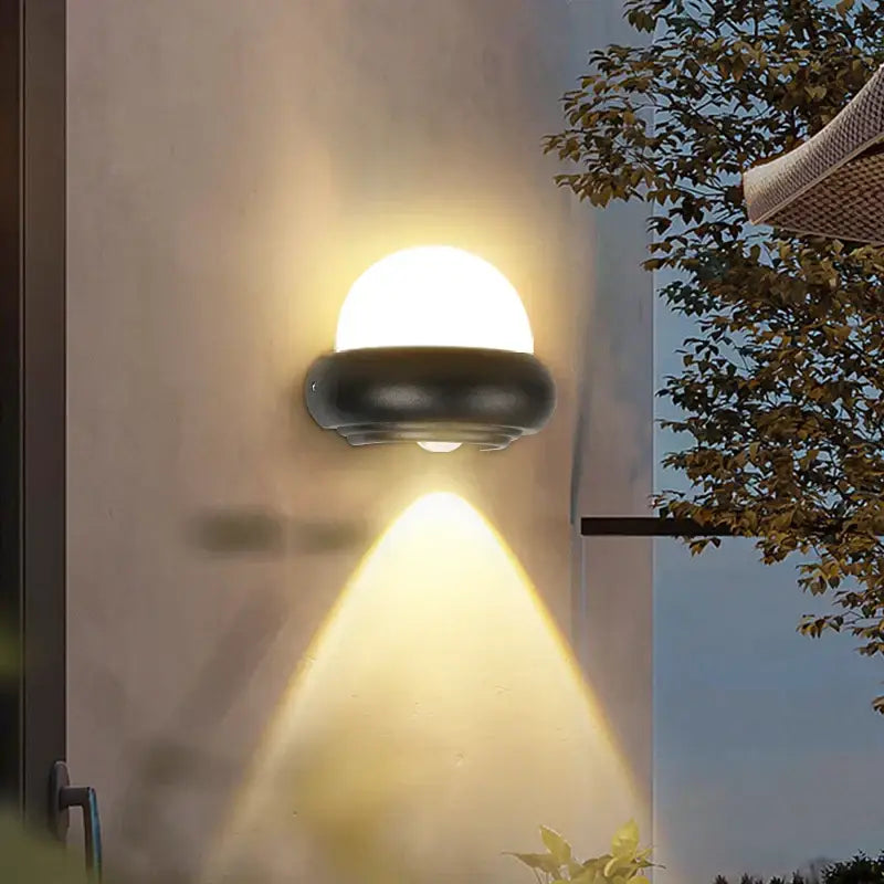 Modern circular black solar wall light with frosted acrylic led diffuser by decorbites for exterior wall lighting