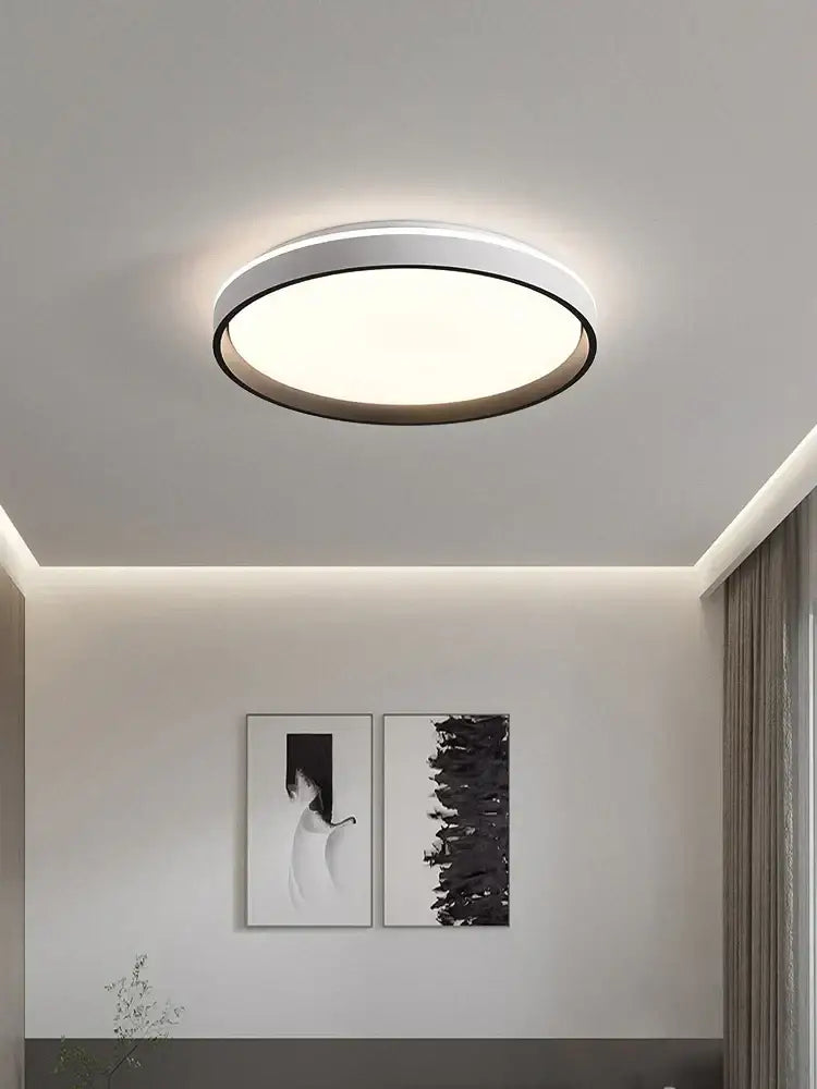 Modern circular black and white led ceiling lamp with sleek frame emitting soft ambient light for bedroom decorbites ceiling lamp