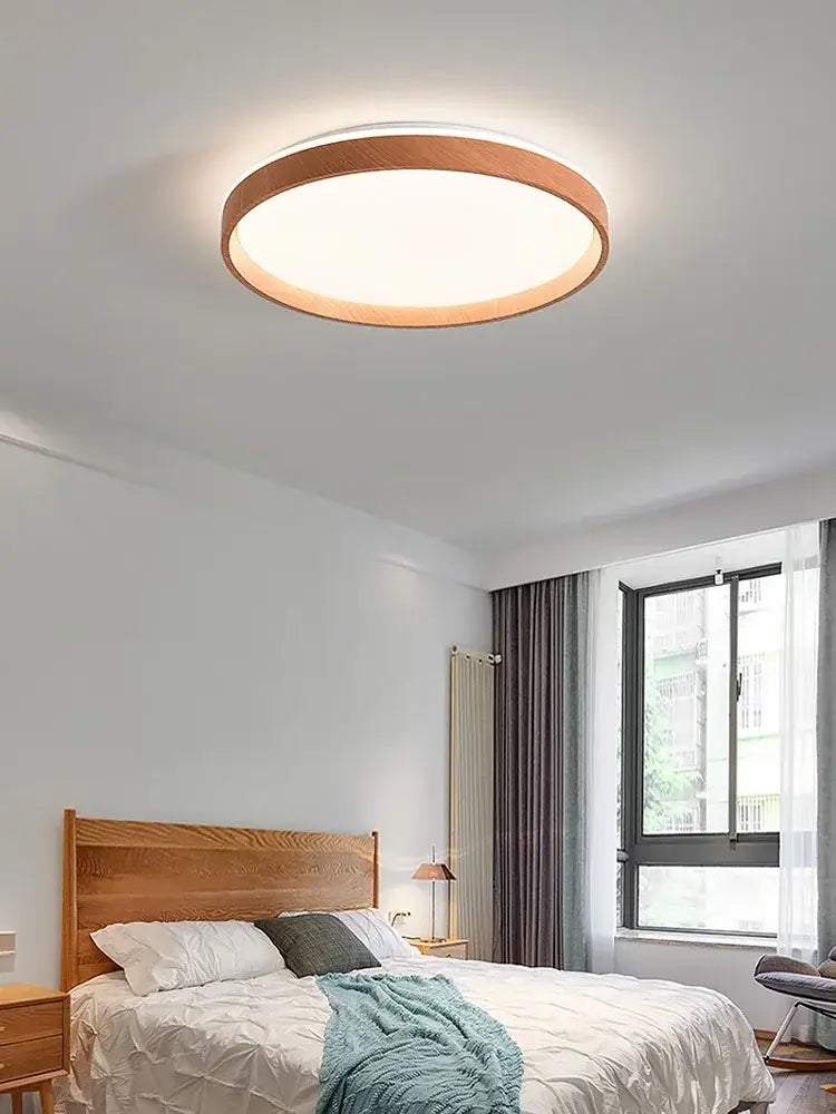 Modern circular black and white decorbites ceiling lamp with warm wood frame and soft white LED light for bedroom decor