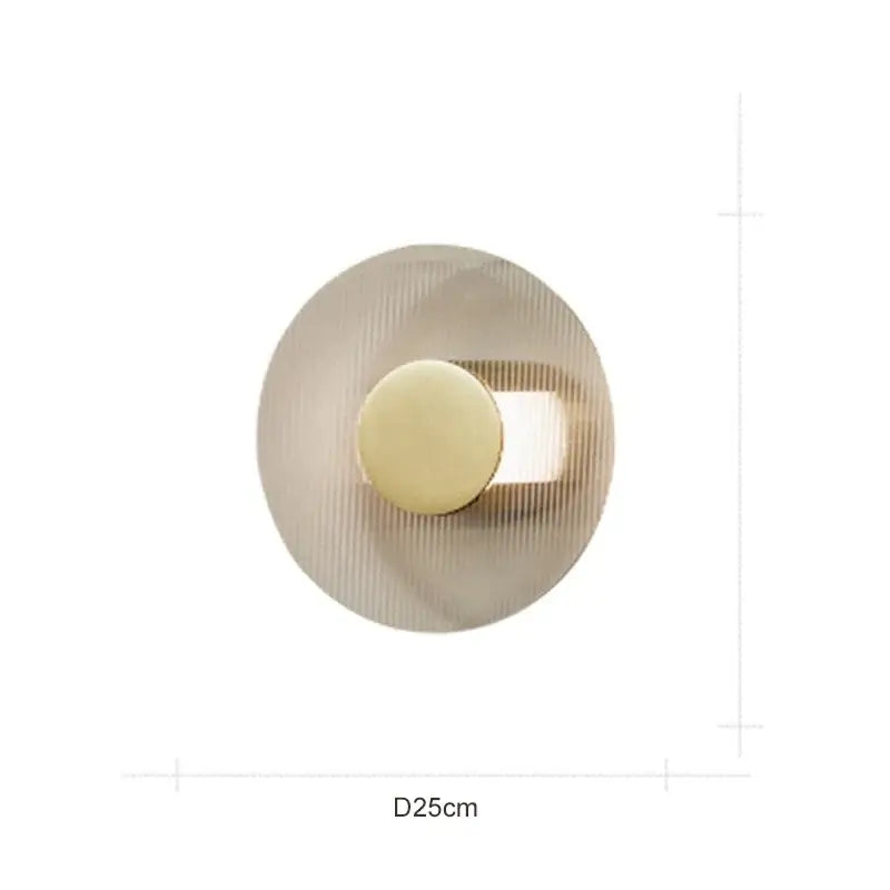 Modern circular brushed metallic wall lamp with brushed gold finish and ridged texture for elegant glass wall decorbites decor