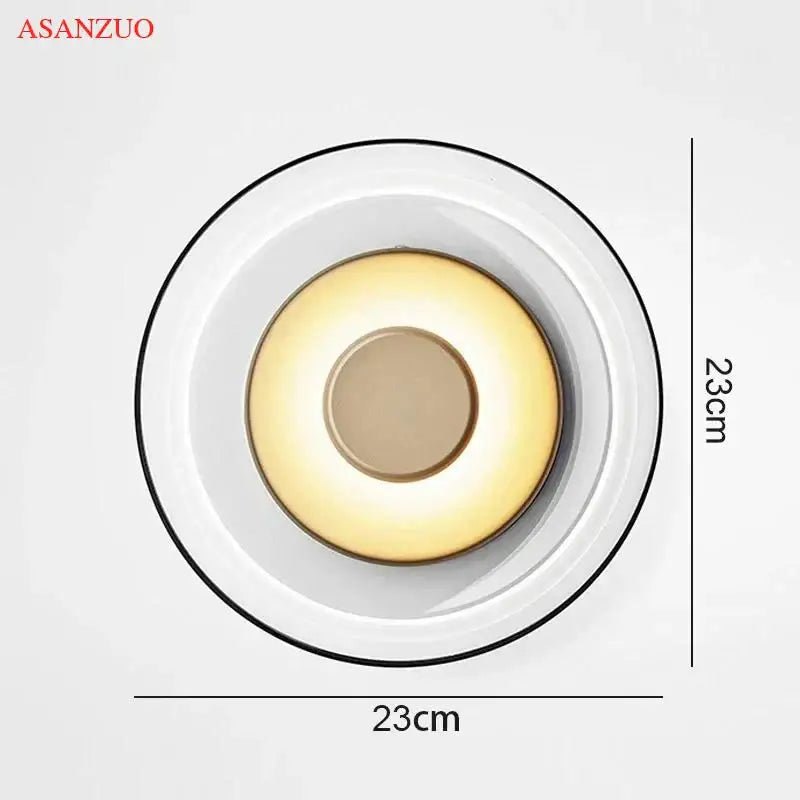 Modern circular glass bowl led wall sconce by Asanzuo with white glass diffuser and warm yellow glow for bedroom decorbites decor