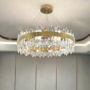A modern circular gold decorbites crystal chandelier with clear crystal prisms for living room decor