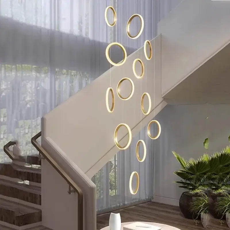 Golden circular decorbites led pendant lights in a modern minimalist arrangement for living room and dining area