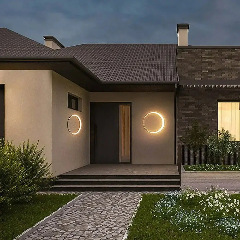 Modern circular led wall lamp with warm glowing ring design for outdoor space decorbites elegant curved style