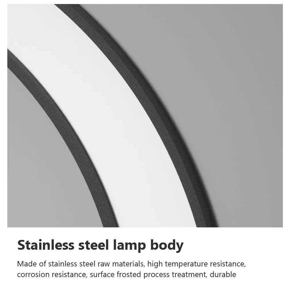 Modern circular led wall lamp with stainless steel body and elegant curved frosted finish for outdoor space decorbites