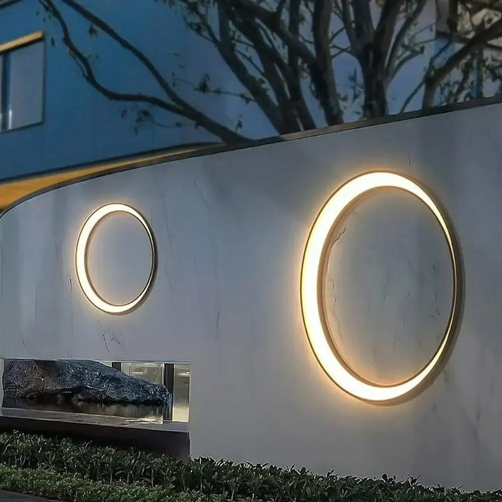 Two modern circular led wall lamps with warm glowing illumination for outdoor space decorbites elegant curved design