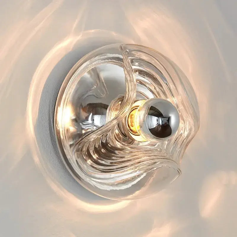 Modern circular swirling designer glass wall lamp with clear glass and polished chrome bulb holder for bedroom decorbites wall lamp