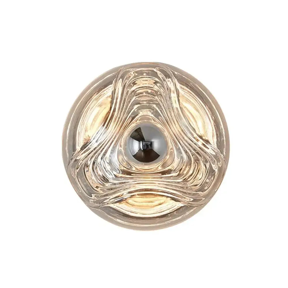 Modern circular swirling designer glass wall lamp with a central reflective element for bedroom decorbites wall lamp decor